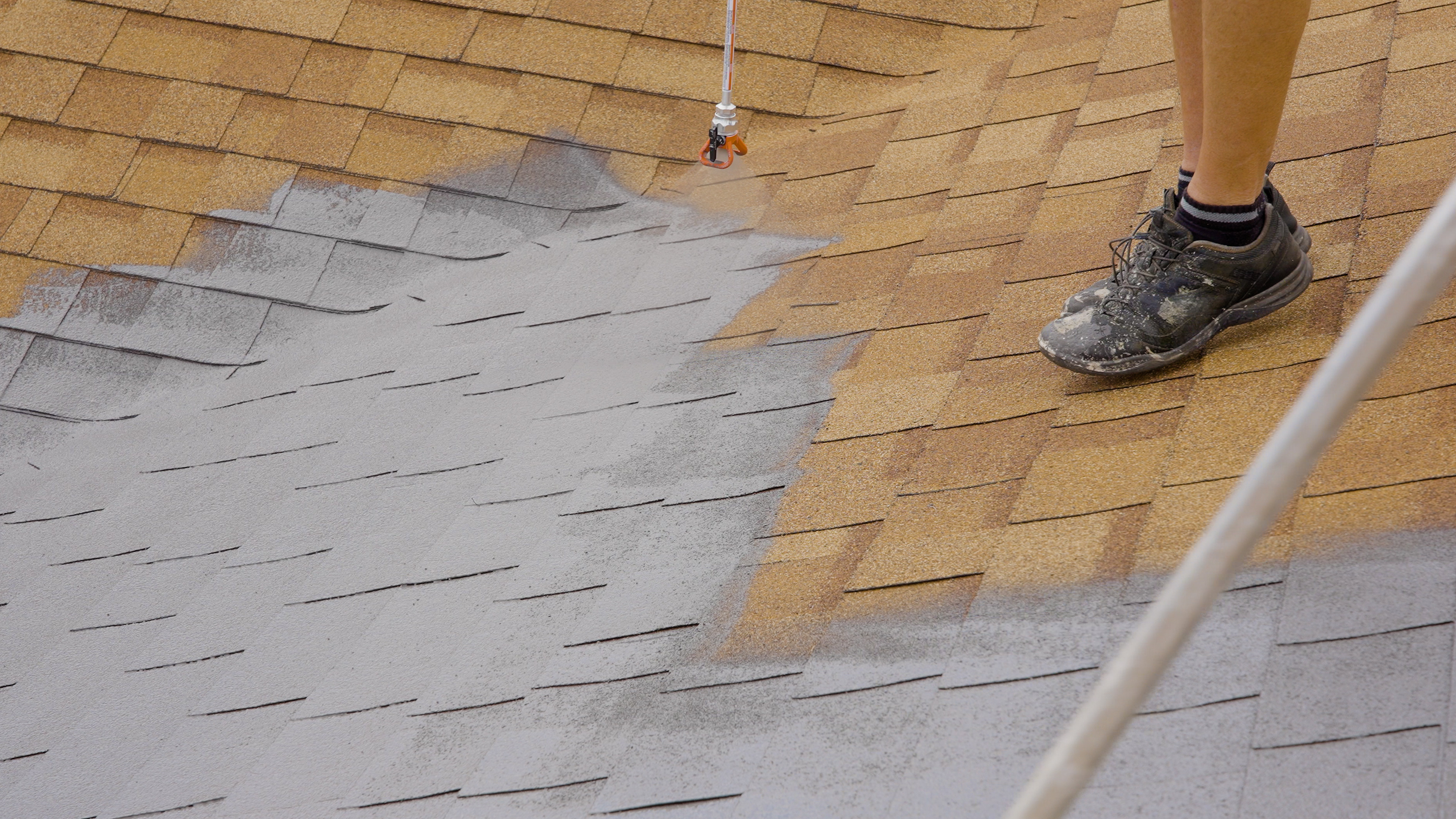 Close-up of Peak 301 bio-oil being sprayed onto shingles